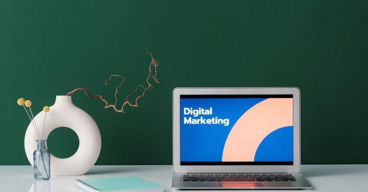 Digital Marketing - Silver Laptop on White Desk with Digital Marketing Label on Screen