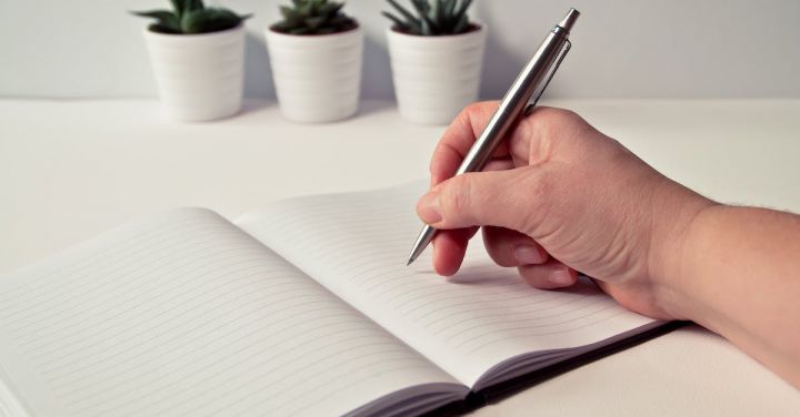 Planning - Person Holding Silver Retractable Pen in White Ruled Book