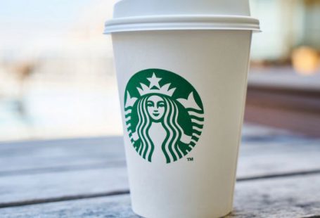 Branding - Closed White and Green Starbucks Disposable Cup
