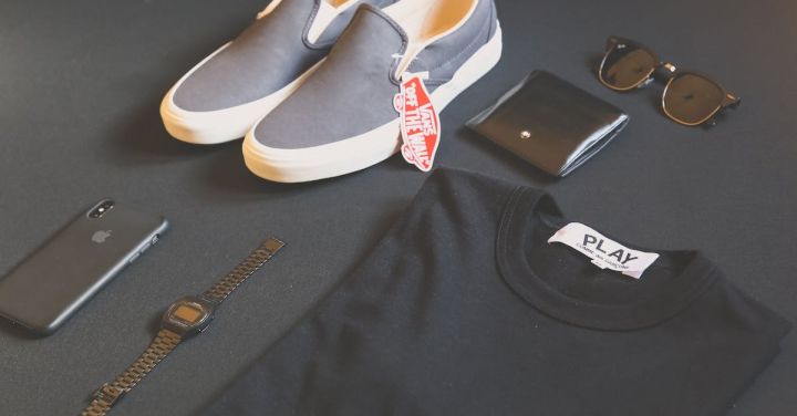 Branding - Pair of Gray Vans Low-top Sneakers Beside Black Shirt, Sunglasses, and Watch