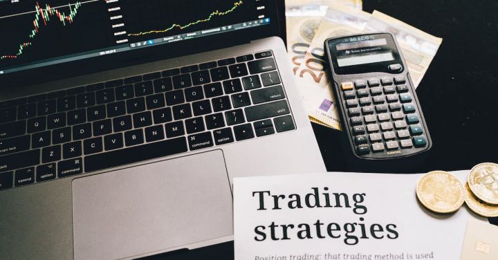 Investment Strategies - Research Paper on Trading Strategies Beside Calculator and Laptop