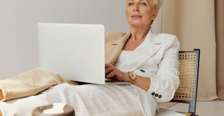 Leadership - Woman Sitting While Using a Laptop
