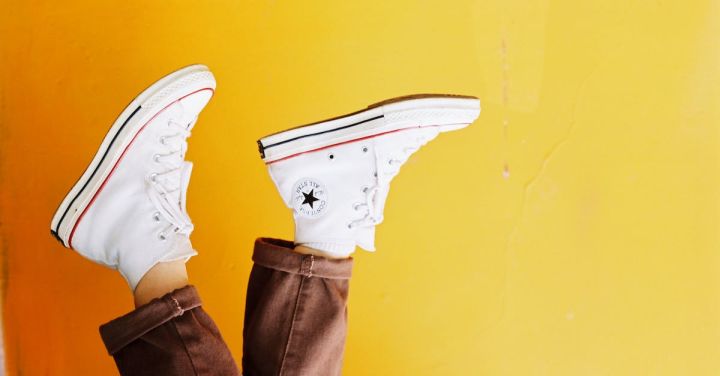 Branding - Photo of Person Wearing Converse All Star Sneakers