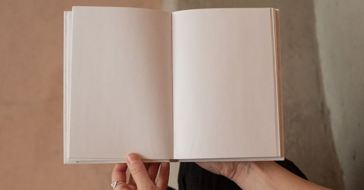 Marketing Campaigns - Woman holding book with blank pages