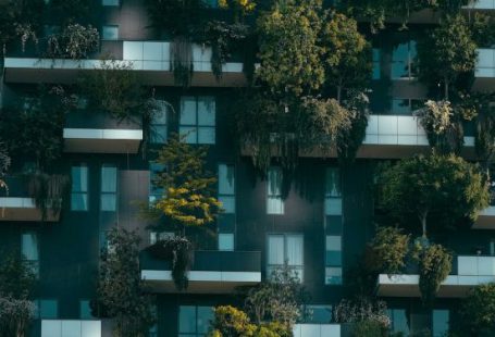 Investment Strategies - Modern residential building facade decorated with green plants