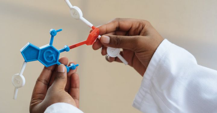 Professional Connections - Crop chemist holding in hands molecule model