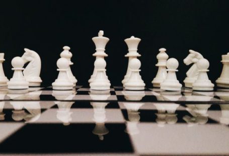 Strategy - White Chess Piece on Top of Chess Board