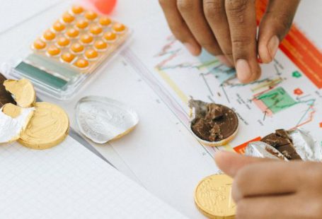 Financial Management - Person Holding Silver and Gold Chocolate Coins