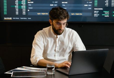 Analytics - Focused Professional Man using Laptop
