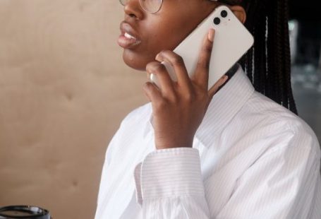 Professional Connections - Black businesswoman speaking on smartphone
