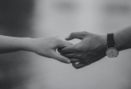 Partnerships - Monochrome Photo of Couple Holding Hands