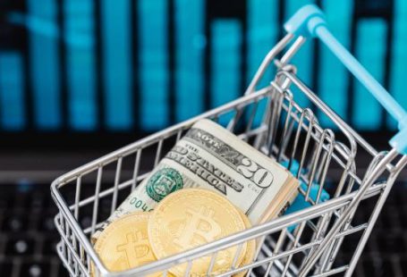 Up Graph - Gold Bitcoin Coins and Cash in a Miniature Shopping Cart